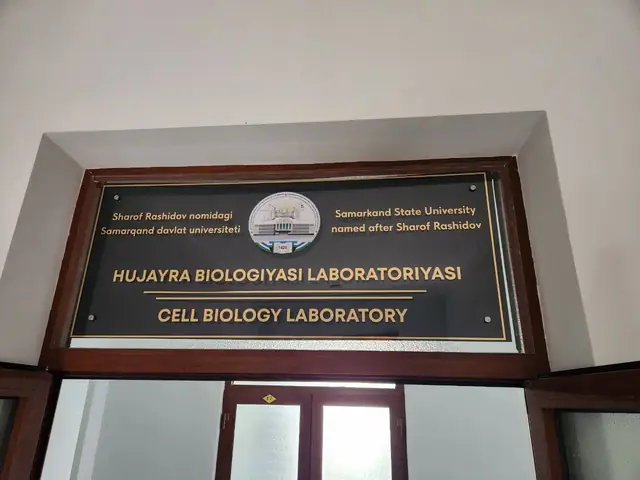 Samarkand State University — Cell Biology Laboratory: табличка лаборатории и настенные дипломные таблички в рамах